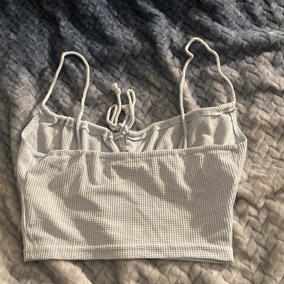 The color is baby blue , it’s originally a small but fits like a medium. - Picture 2 of 2